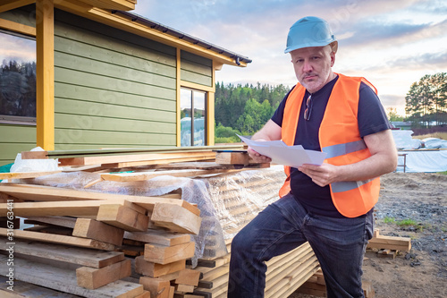 Builder near the boards. Cu...
