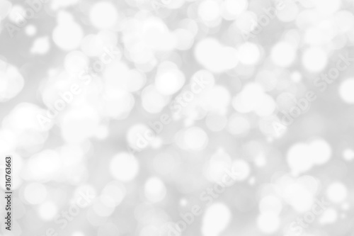 Abstract background with White bokeh on gray background. christmas blurred beautiful shiny Christmas lights.
