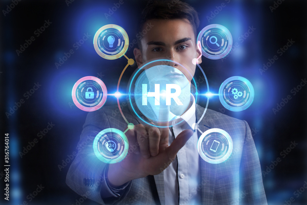 Business, Technology, Internet and network concept. Young businessman working on a virtual screen of the future and sees the inscription: Business, Technology, Internet and network concept. Young businessman working on a virtual screen of the future and sees the inscription: