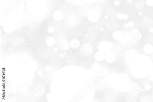 Abstract background with White bokeh on gray background. christmas blurred beautiful shiny Christmas lights.