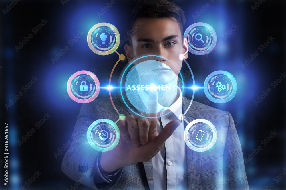 Business, Technology, Internet and network concept. Young businessman working on a virtual screen of the future and sees the inscription: Business, Technology, Internet and network concept. Young businessman working on a virtual screen of the future and sees the inscription: