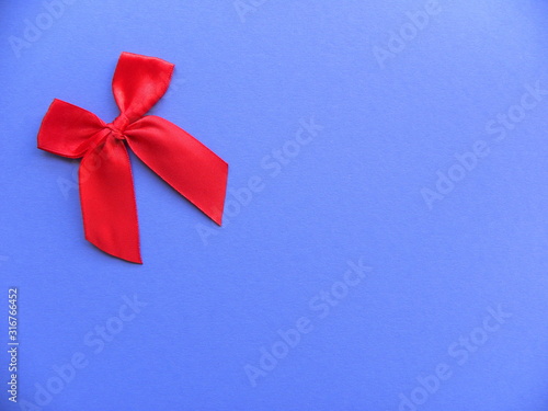red bow on a lilac background