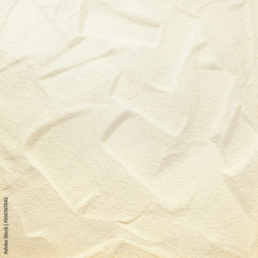 Natural background - beautiful texture of fine white beach sand with a Golden sheen close-up. Natural background - beautiful texture of fine white beach sand with a Golden sheen close-up.