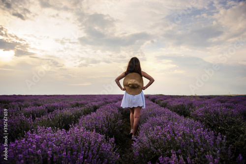 back view of a woman with hat in lavender field