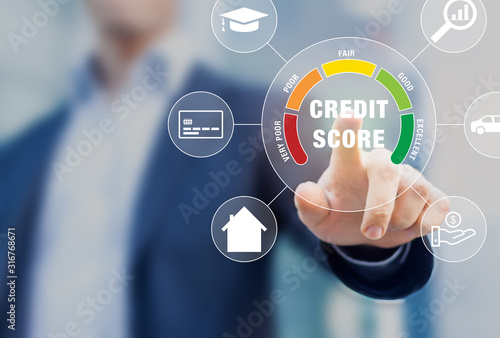 Credit Score rating based on debt reports showing creditworthiness or risk of individuals for student loan, mortgage and payment cards, concept with business person touching scorecard on screen photo
