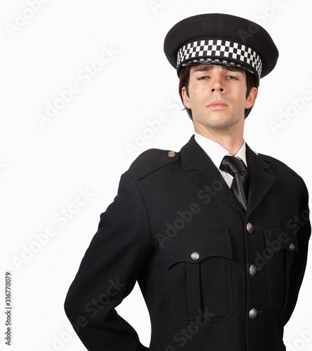 Portrait of confident police officer against white background © moodboard