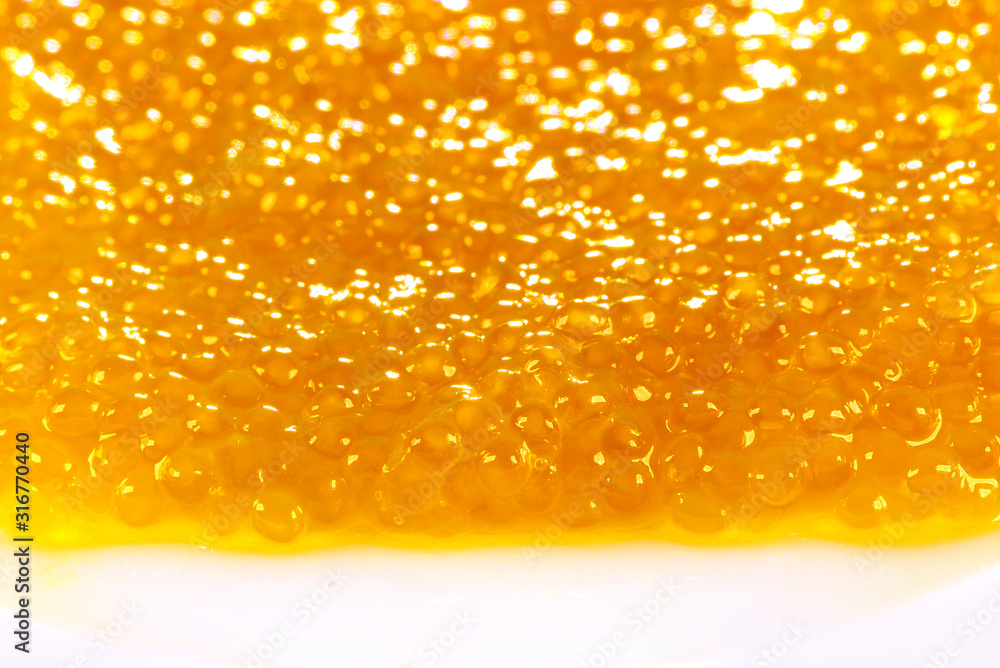 Delicacy copy space. Raw fish caviar close-up. Seafood background for design. Delicacy copy space. Raw fish caviar close-up. Seafood background for design.