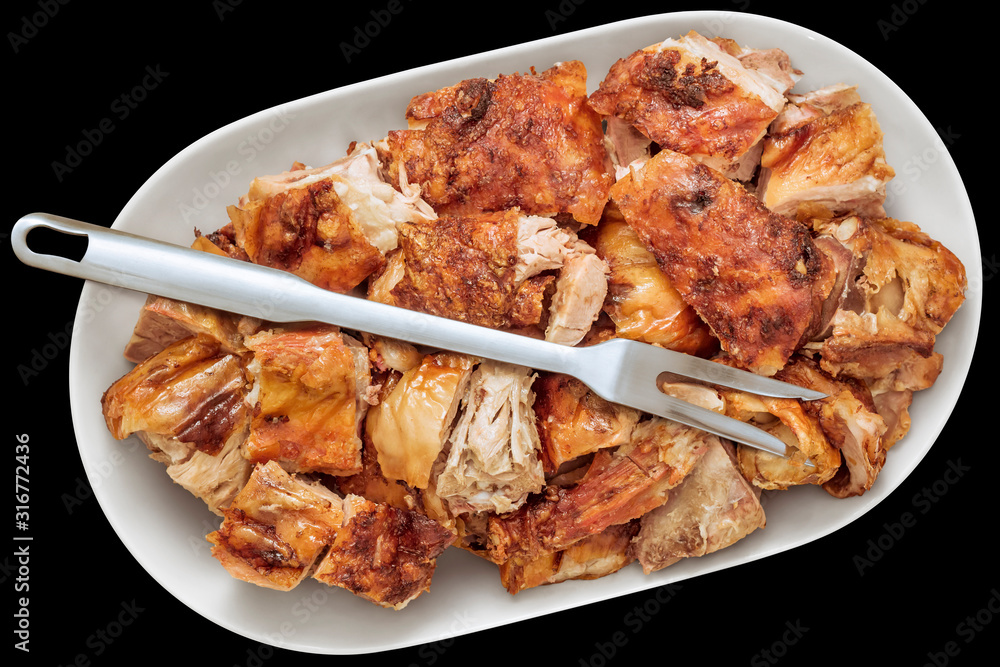 Freshly Spit Roasted Pork Thigh Meat Slices Offered on Oblong Porcelain Tray with Serving Fork Isolated on Black Background Freshly Spit Roasted Pork Thigh Meat Slices Offered on Oblong Porcelain Tray with Serving Fork Isolated on Black Background