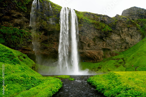 Beautiful view of the tall waterfall of Seljalandsfoss  Iceland in the summer