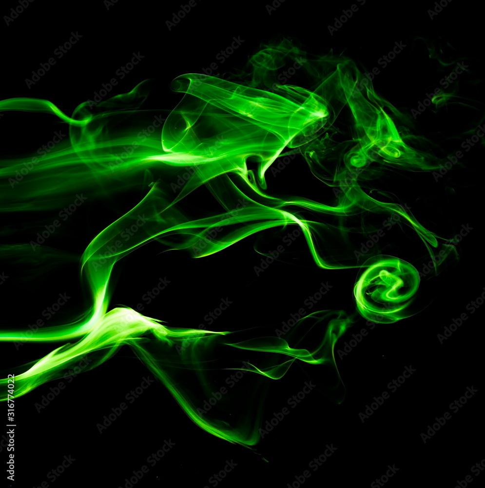 Green smoke on black background Green smoke on black background