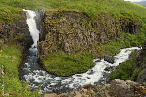 The view of Fardagafoss, a remotely located waterfalls near Seydisfjordur, Iceland in the summer © K.A
