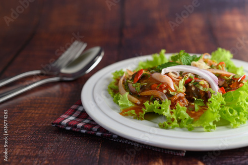 Spicy salad of sardine in tomato sauce inviting hungry
