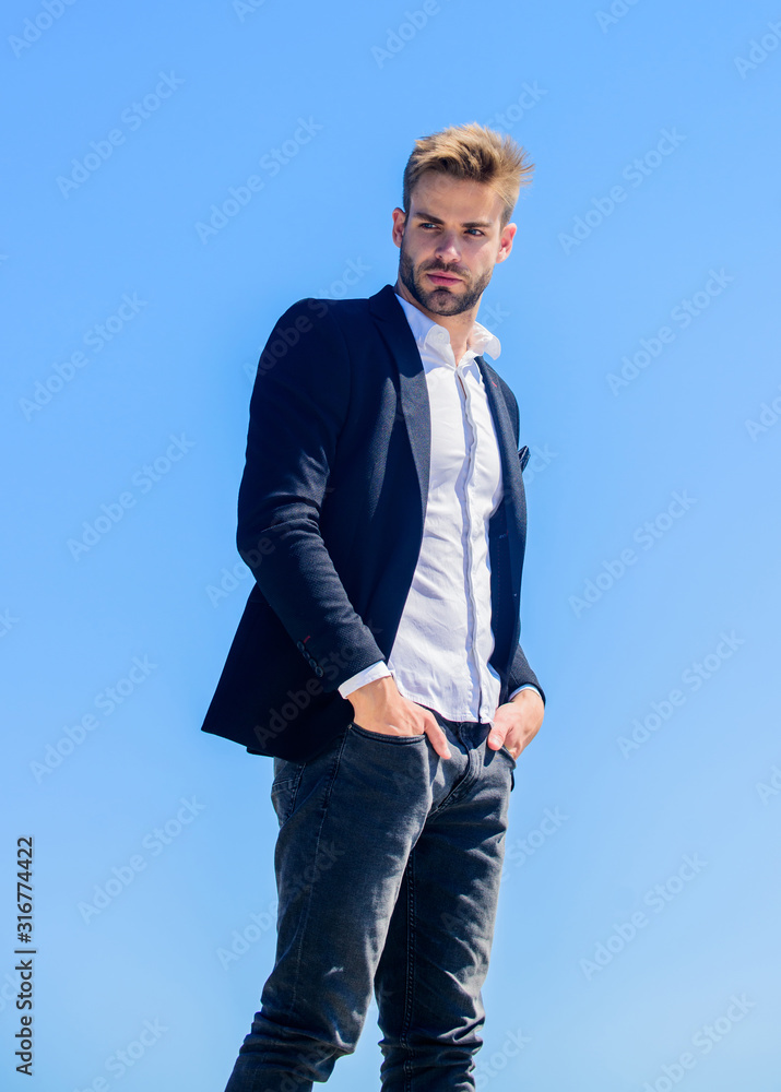 Handsome man wear suit. Young entrepreneur businessman. On top of world. Hipster with beard. Businessman against blue sky. Future success. Male formal fashion. Bearded man. Successful businessman