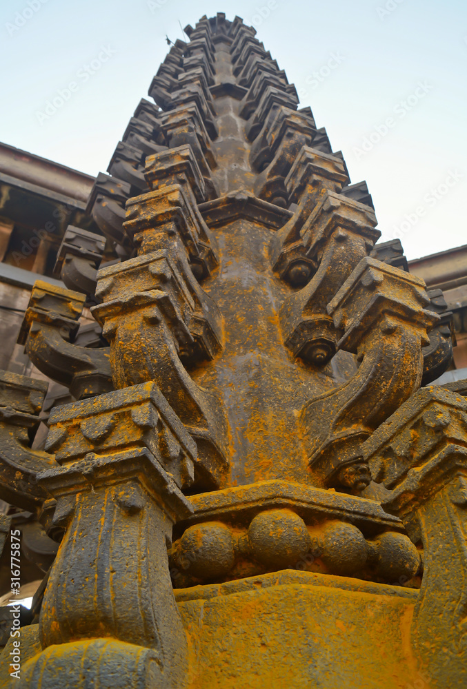 Jejuri, Pune, Maharashtra January 19, 2020. Deepstambh (light pillar) dipmala in black stone. Closeup of light pillor known as deepstambh