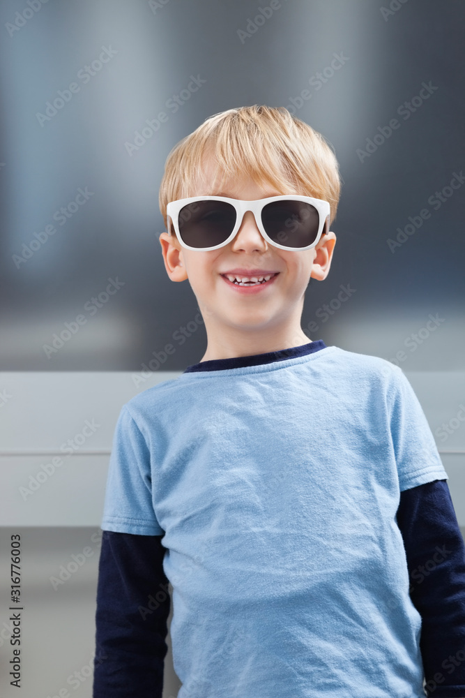 Portrait of Caucasian boy in casuals wearing sunglasses Portrait of Caucasian boy in casuals wearing sunglasses