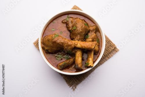 Hyderabadi Mutton Paya, Nehari, nahari or Nihari Masala. served with Naan and rice. selective focus