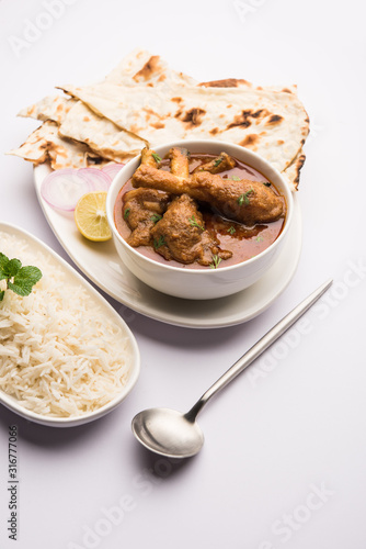 Hyderabadi Mutton Paya, Nehari, nahari or Nihari Masala. served with Naan and rice. selective focus photo