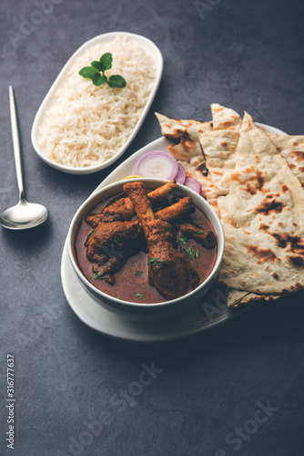 Hyderabadi Mutton Paya, Nehari, nahari or Nihari Masala. served with Naan and rice. selective focus photo