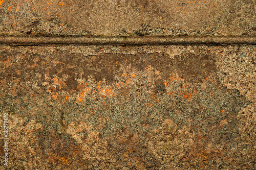 Fragment of striking metal sheet with weld. Textural background. Close up. photo