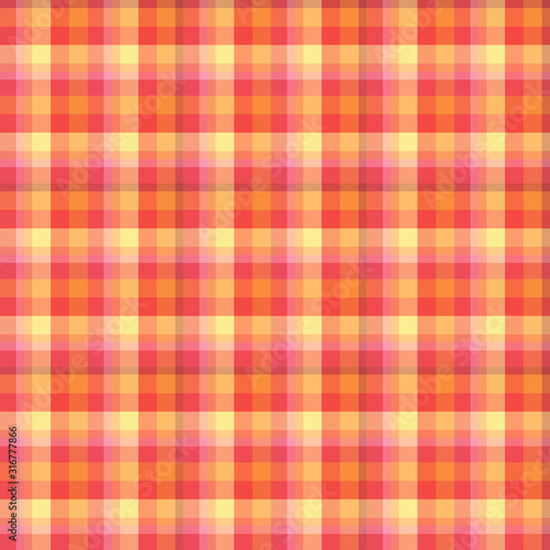 Checkered background in festive red, yellow, orange colors. Seamless pattern for plaid, fabric, textile, clothes, tablecloth and other things.