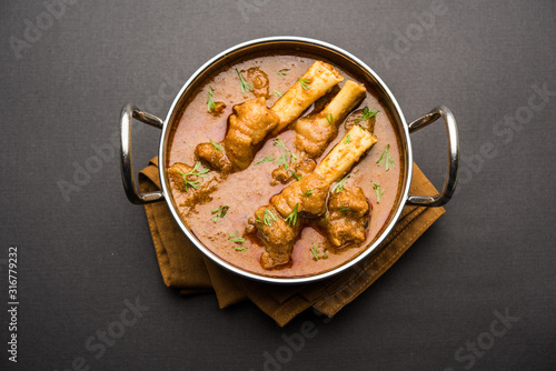 Hyderabadi Mutton Paya, Nehari, nazari or Nihari Masala. served with Naan and rice. selective focus photo