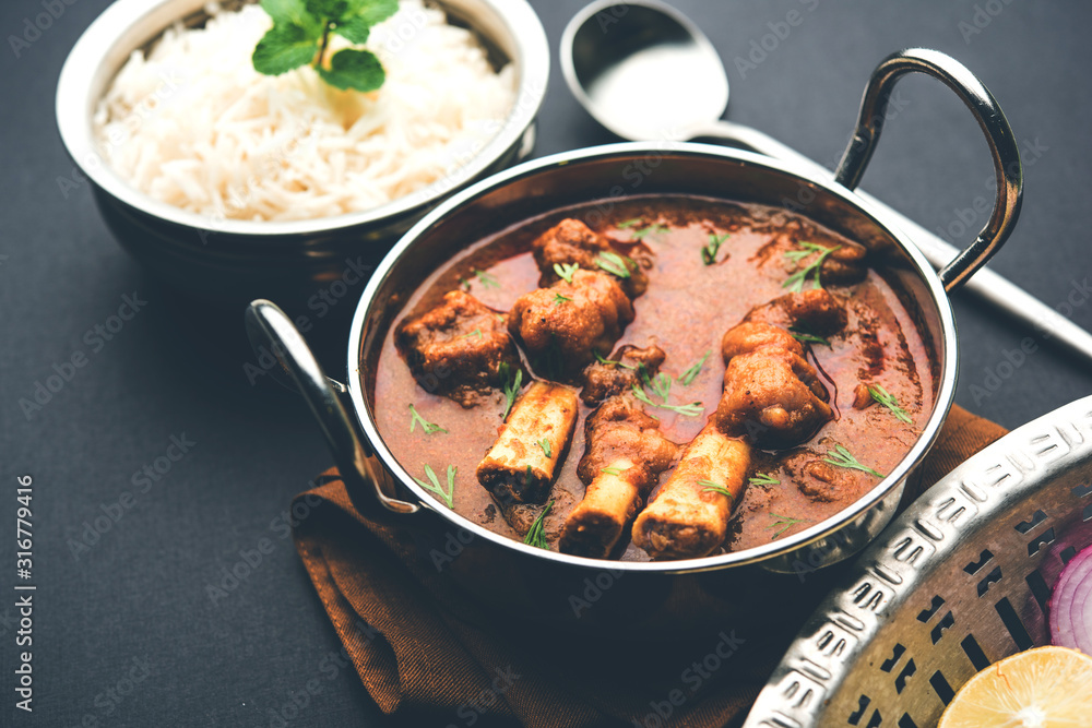 Hyderabadi Mutton Paya, Nehari, nazari or Nihari Masala. served with Naan and rice. selective focus Hyderabadi Mutton Paya, Nehari, nazari or Nihari Masala. served with Naan and rice. selective focus