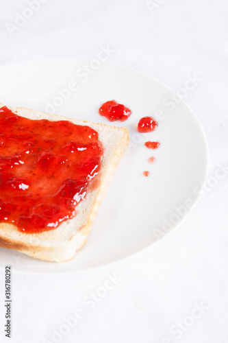 Close-up of jam spread on slice of bread