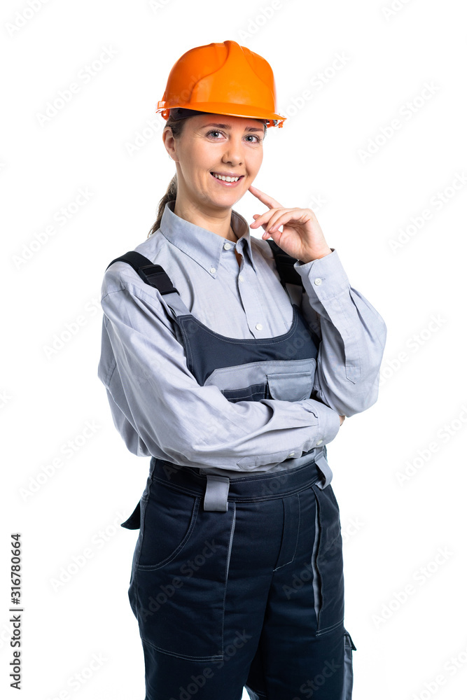pretty cute builder girl in uniform and helmet . Isolated pretty cute builder girl in uniform and helmet . Isolated