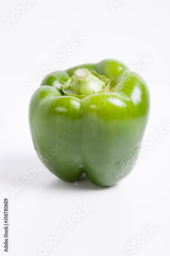 Close-up of green bell pepper over white background
