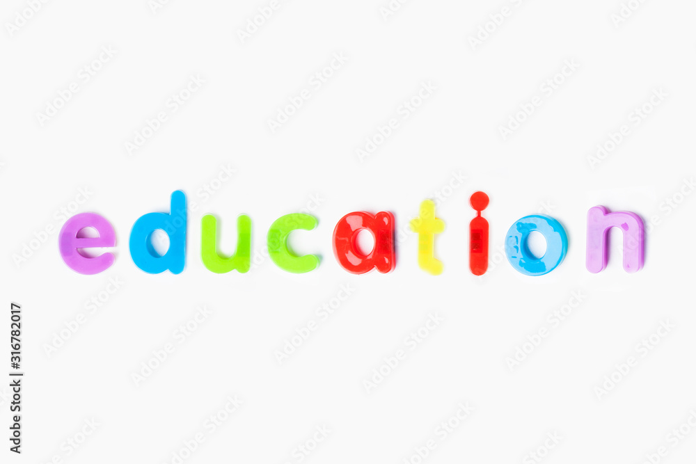 Education' spelled with colorful alphabet magnets over white background Education' spelled with colorful alphabet magnets over white background