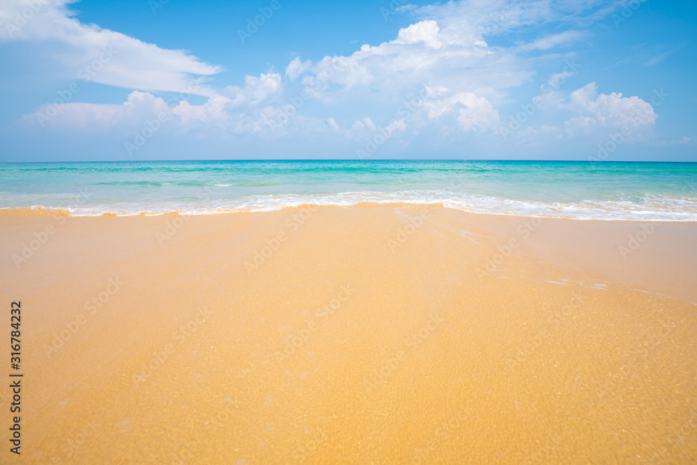 Fototapeta premium Beautiful clear sea beach white sand against blue sky with cloud