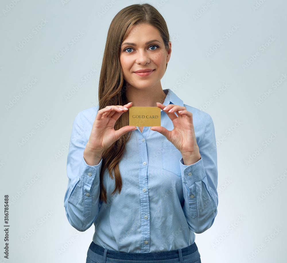 smiling woman holding credit card in front of. smiling woman holding credit card in front of.