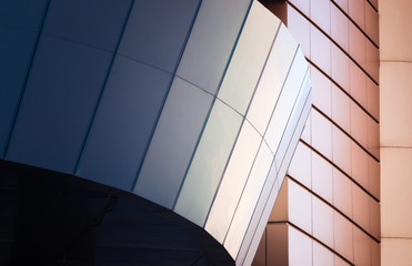 fragment of the wall of a modern blue building on a white background