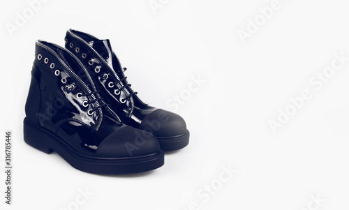 stylish black boots on white background © martina87