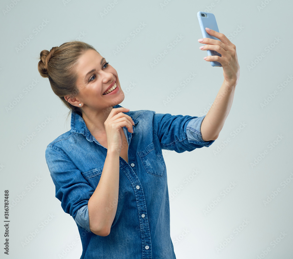 woman in casual wear making self portrait and touching face. woman in casual wear making self portrait and touching face.