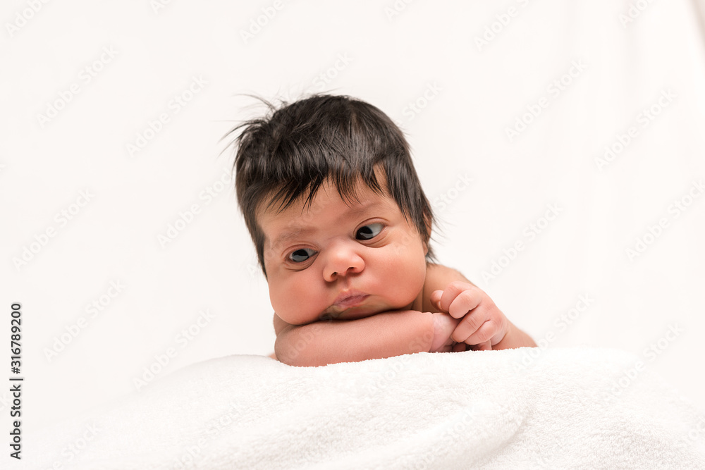 adorable and naked mixed race newborn baby isolated on white adorable and naked mixed race newborn baby isolated on white
