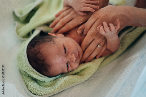 Authentic photography of a newborn with slightly lower birth weight. 