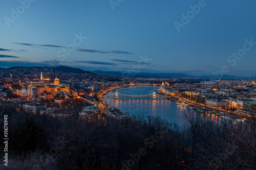 Aerial view Budapest, Hungary by evening. Buda castle, Chain bridge and Parliament building