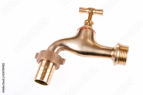 Classic brass faucet for the garden. Isolated on white