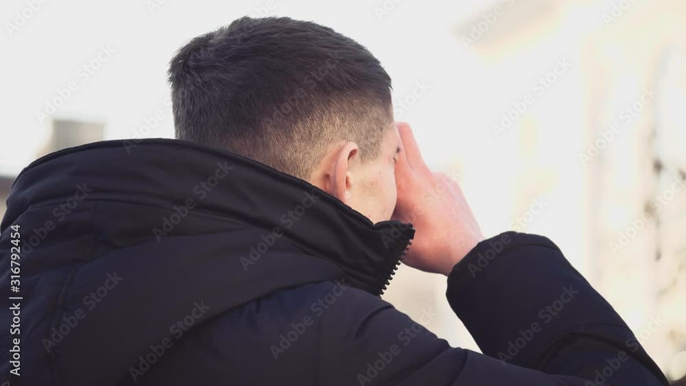 Handsome guy is looking around and taking a photo. He is concentrated. Copy space. Action. Animation. 4K. Handsome guy is looking around and taking a photo. He is concentrated. Copy space. Action. Animation. 4K.