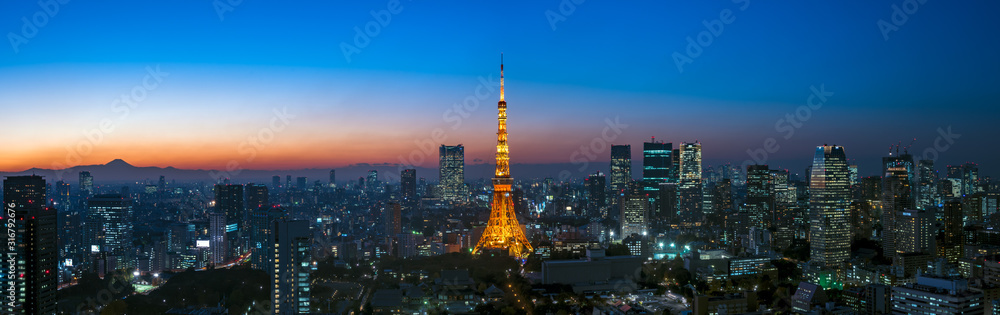 Panorama image of Tokyo tower and skyscrapers at magic hour