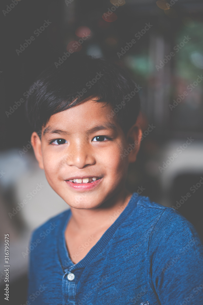 young asia boy alone in the house