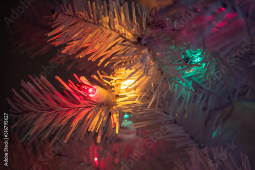 Macro shot of Christmas tree lights and decorations © Jessica