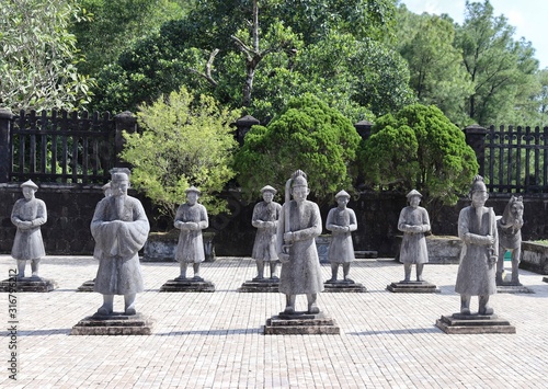 Stone statues outside asian temple 