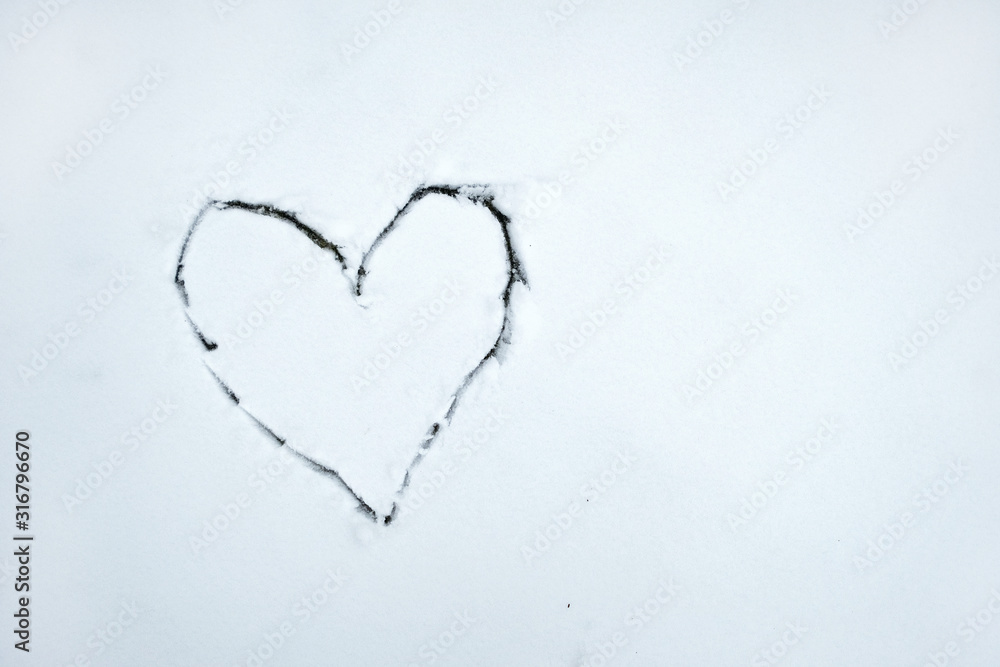 Heart drawn by stick on white snow . Beautiful winter background for Valentines Day or Christmas. Stock photo. Heart drawn by stick on white snow . Beautiful winter background for Valentines Day or Christmas. Stock photo.