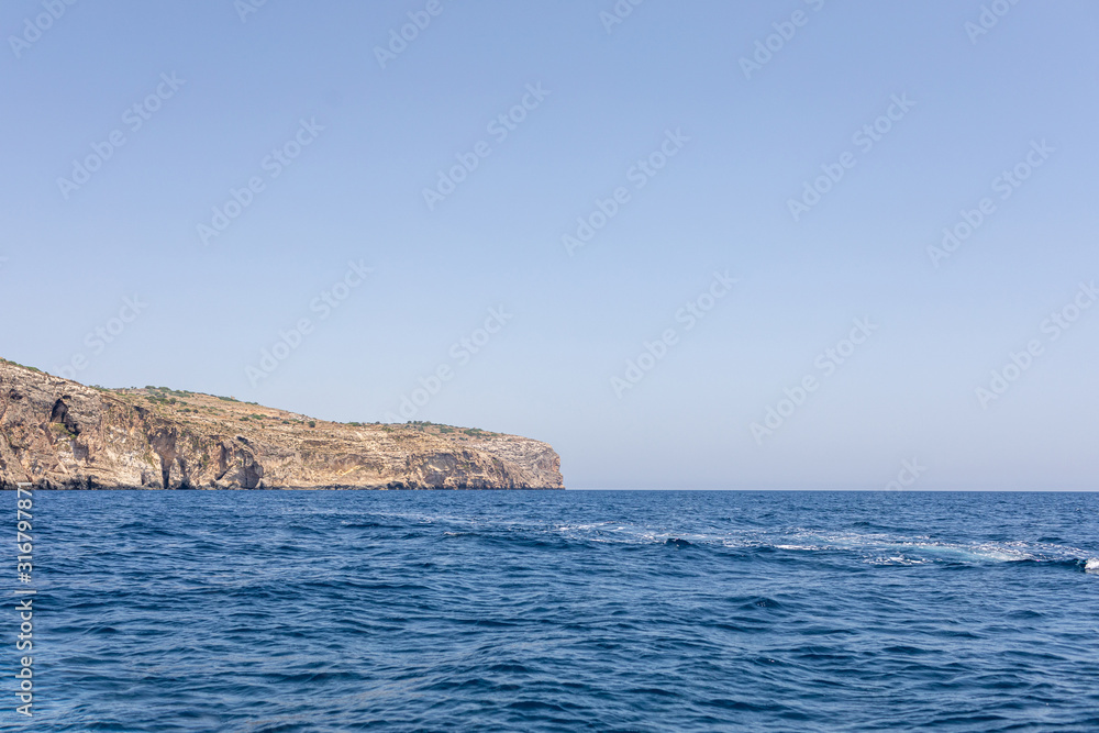 Fantastic views of rocky coast on a sunny day with blue sky. Picturesque and gorgeous scene. Malta. Europe. Mediterranean sea. Beauty world.