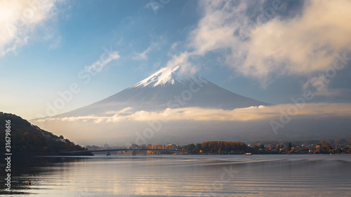 Mount Fuji and the morning fog in autumn at Lake Kawaguchiko, Japan's popular tourist attraction. © Basicdog