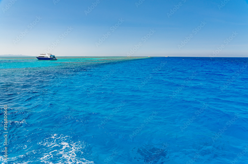 Egypt, Red Sea, blue clear water, view from the yacht to the horizon. Egypt, Red Sea, blue clear water, view from the yacht to the horizon.