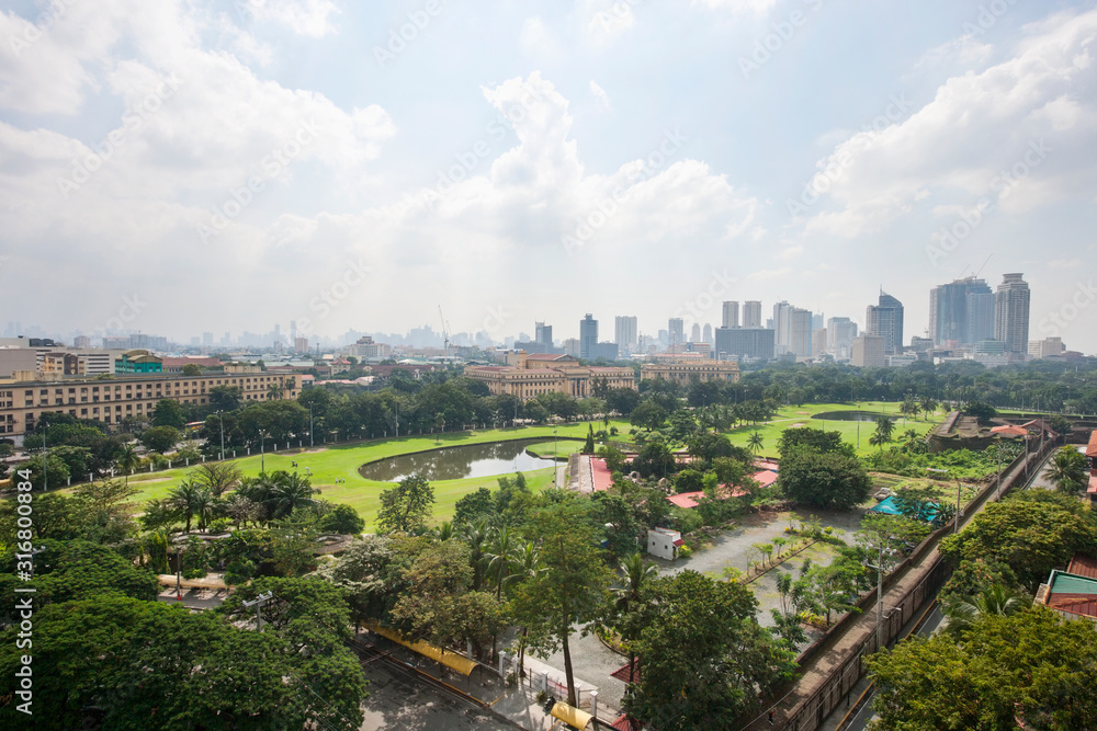 View of golf course and city skyline; Manila; Philippines