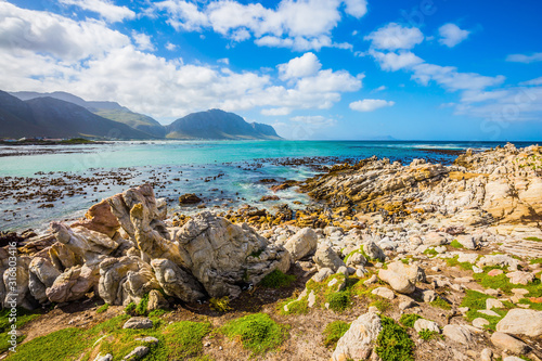  The azure water, boulders and algae